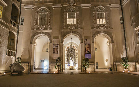 Illuminated courtyard of Salzburg’s DomQuartier at night