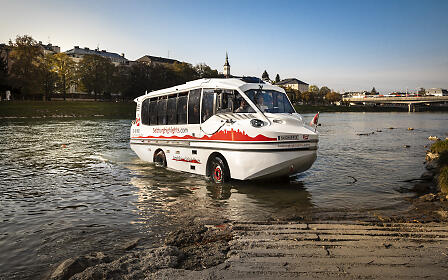 Salzach boat trip - amphibious bus leaving the Salzach in the sunshine