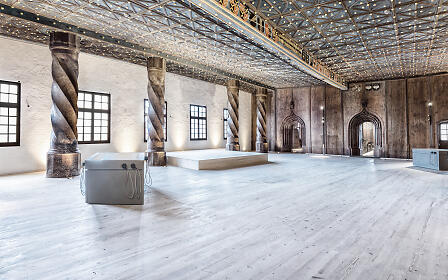 A magnificent hall with twisted columns, wooden floors and an ornate coffered ceiling at fortress Hohensalzburg