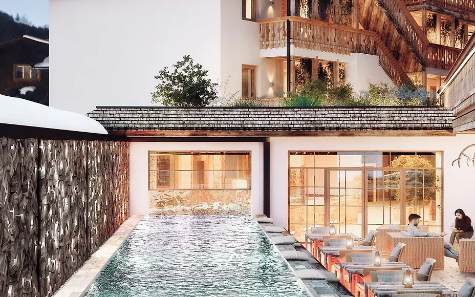 Luxuriöses Alpenhotel mit elegantem Infinitypool, rustikaler Holzarchitektur und moderner Terrasse im Salzburger Landstil.